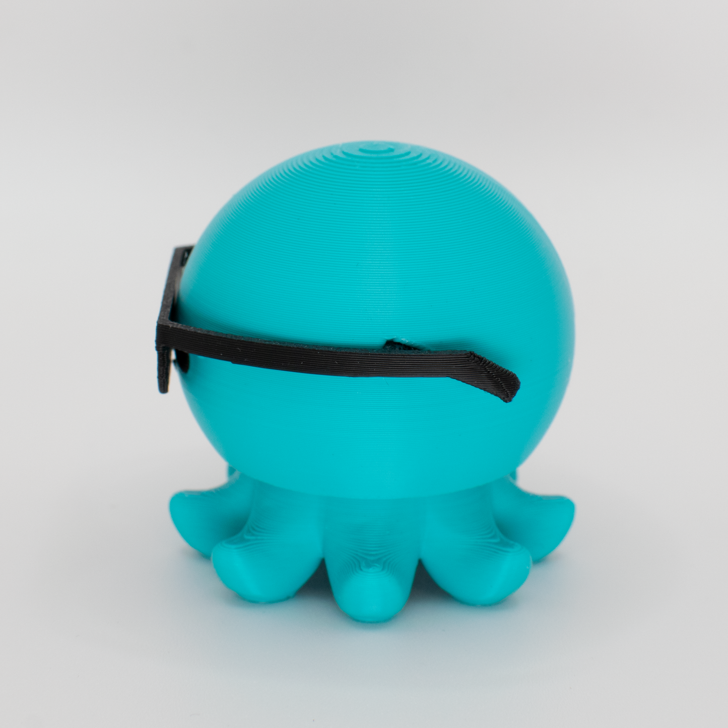Side view of an original octopus mechanical switch fidget toy