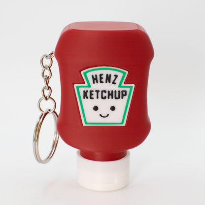 Red ketchup bottle fidget clicker keychain with a smiley face