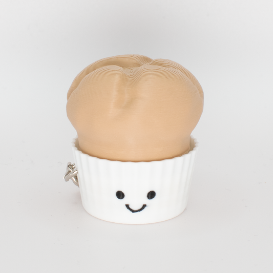cute muffin fidget clicker keychain with a smiling face