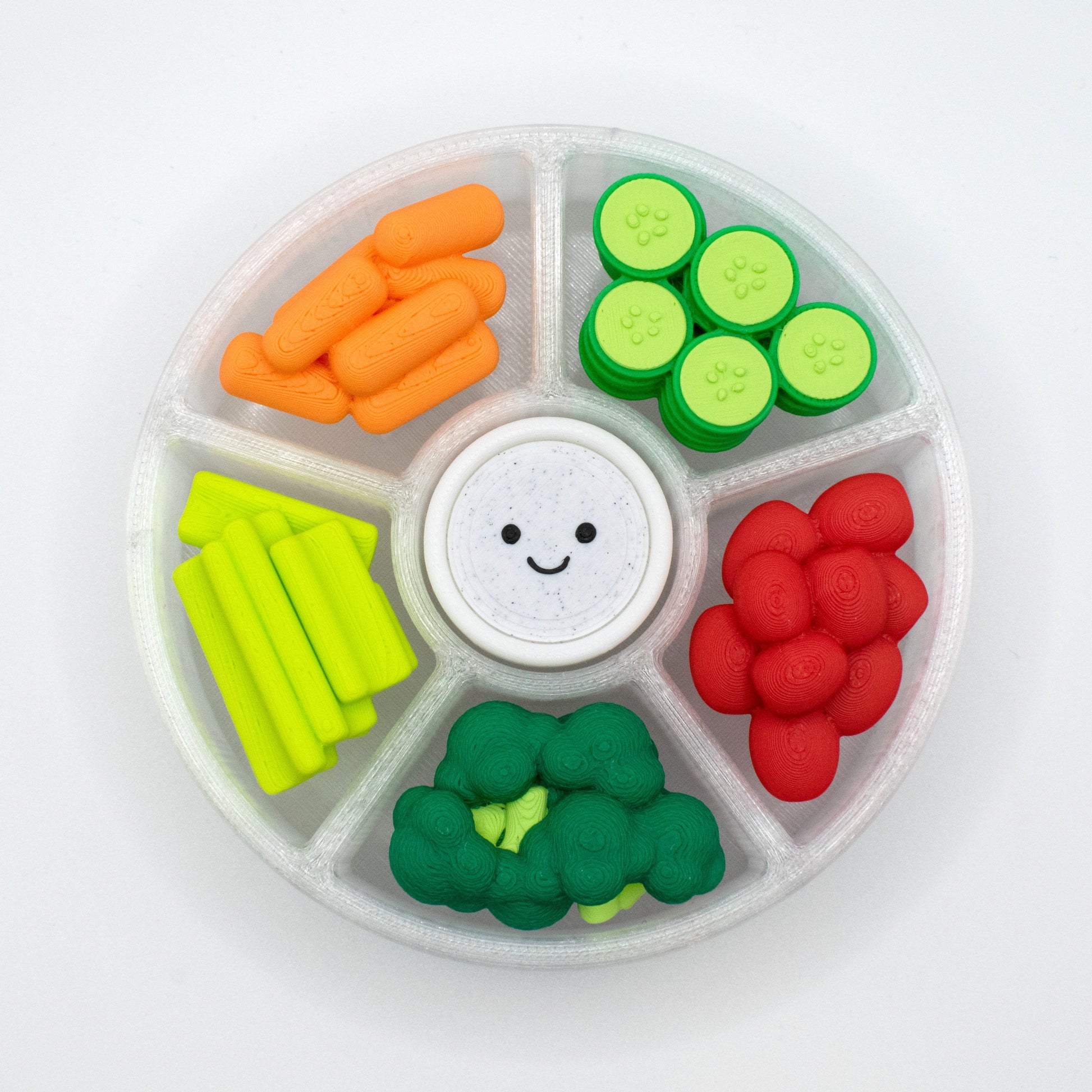 Top view of a cute round veggie platter fidget clicker, which has 6 compartments on a white background