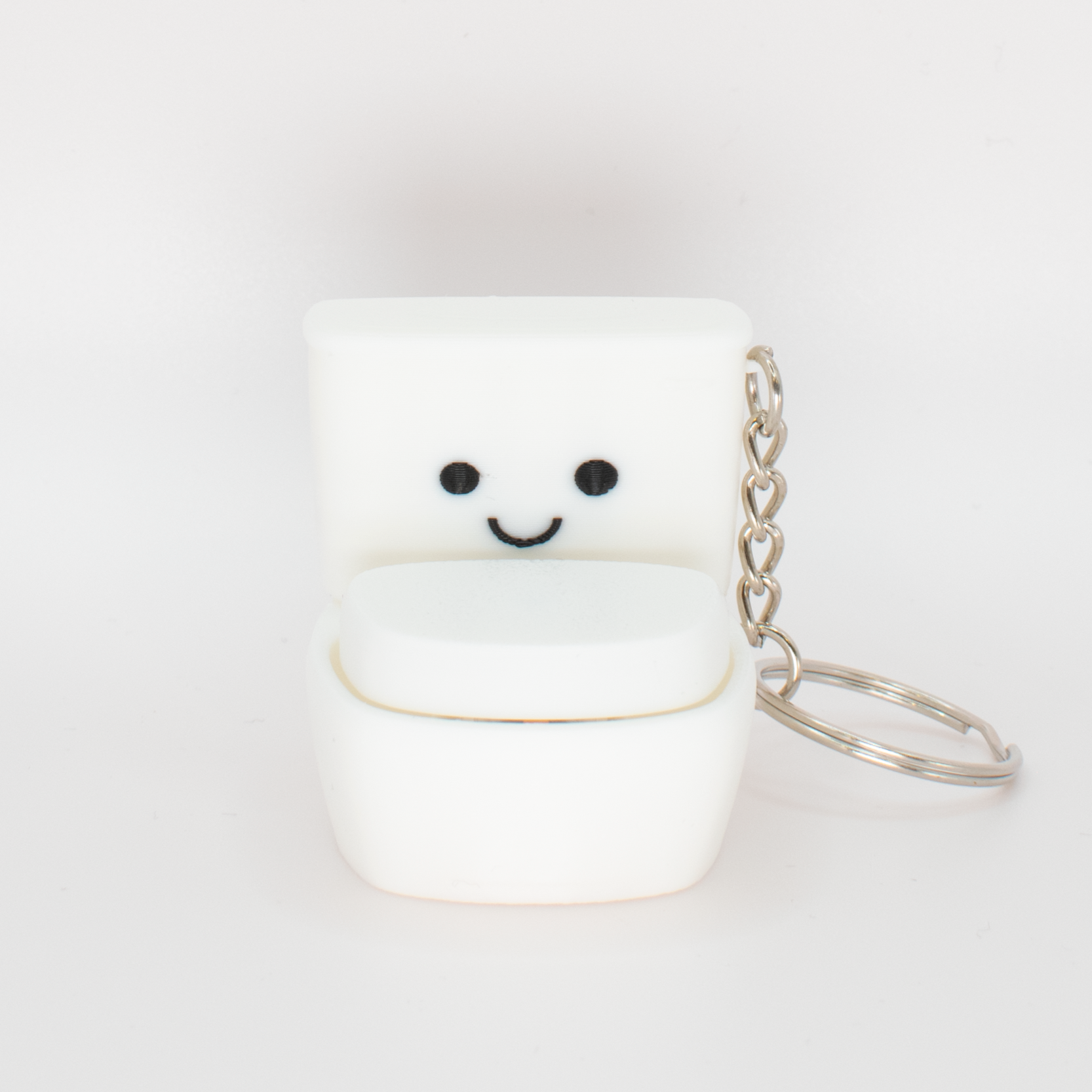 Funny cute toilet fidget clicker keychain with a smiling face