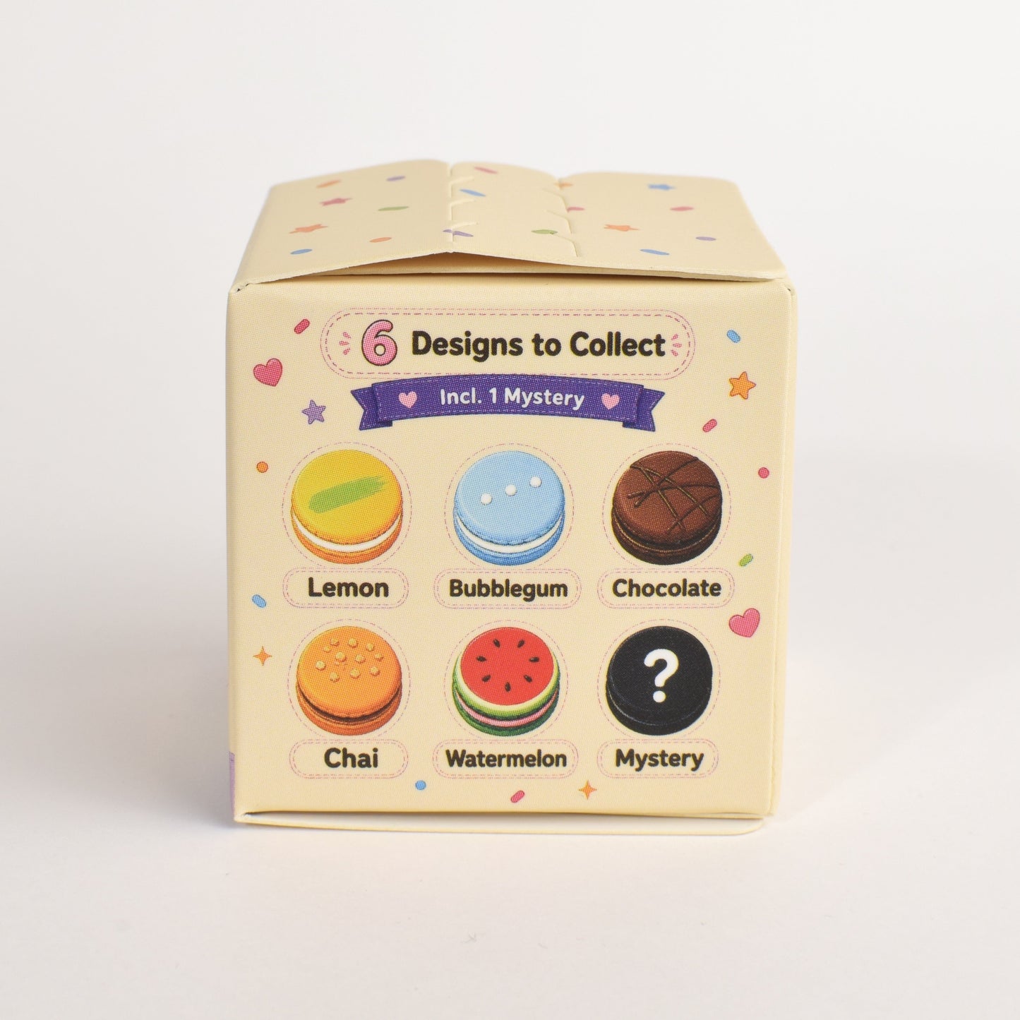 Side view of the Mystery Macaron Clicker Blind Box showing the 6 possible designs