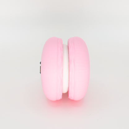 Side view of an original macaron fidget clicker keychain showing the filling
