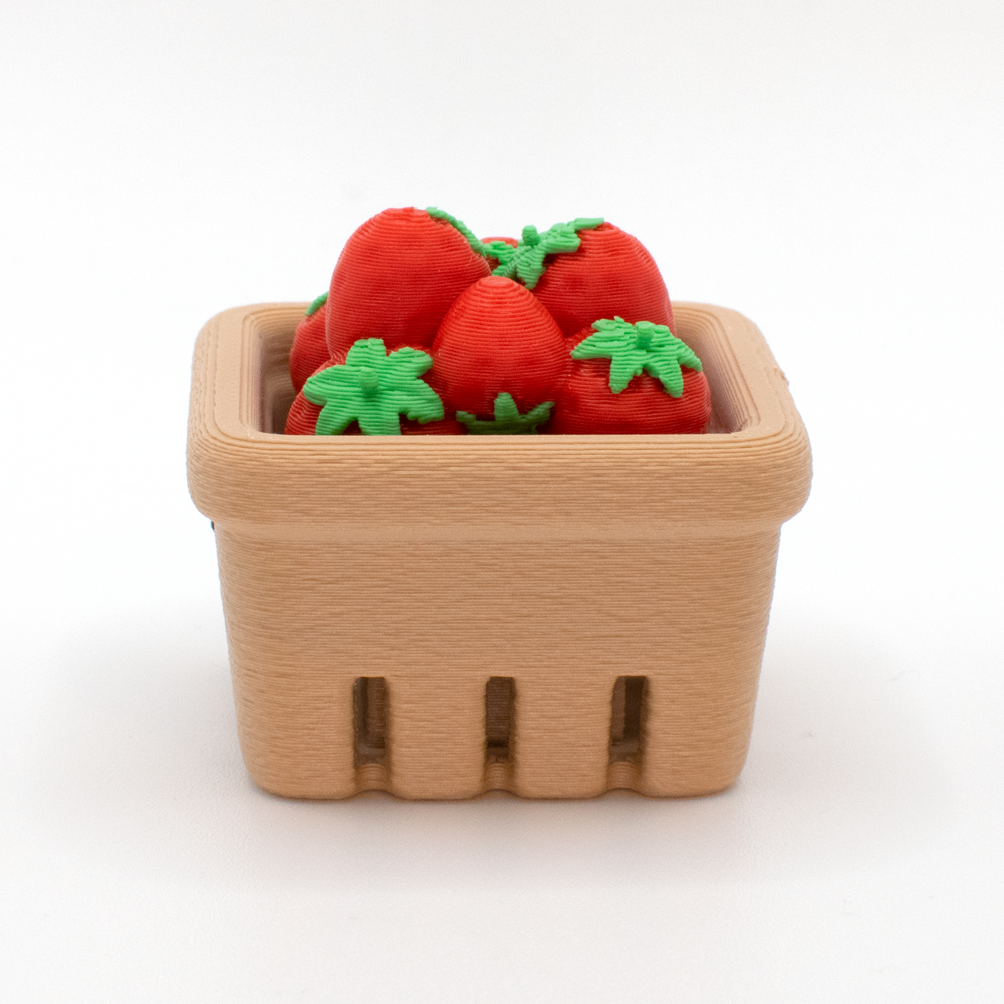 Side view of an original strawberry basket fidget clicker keychain