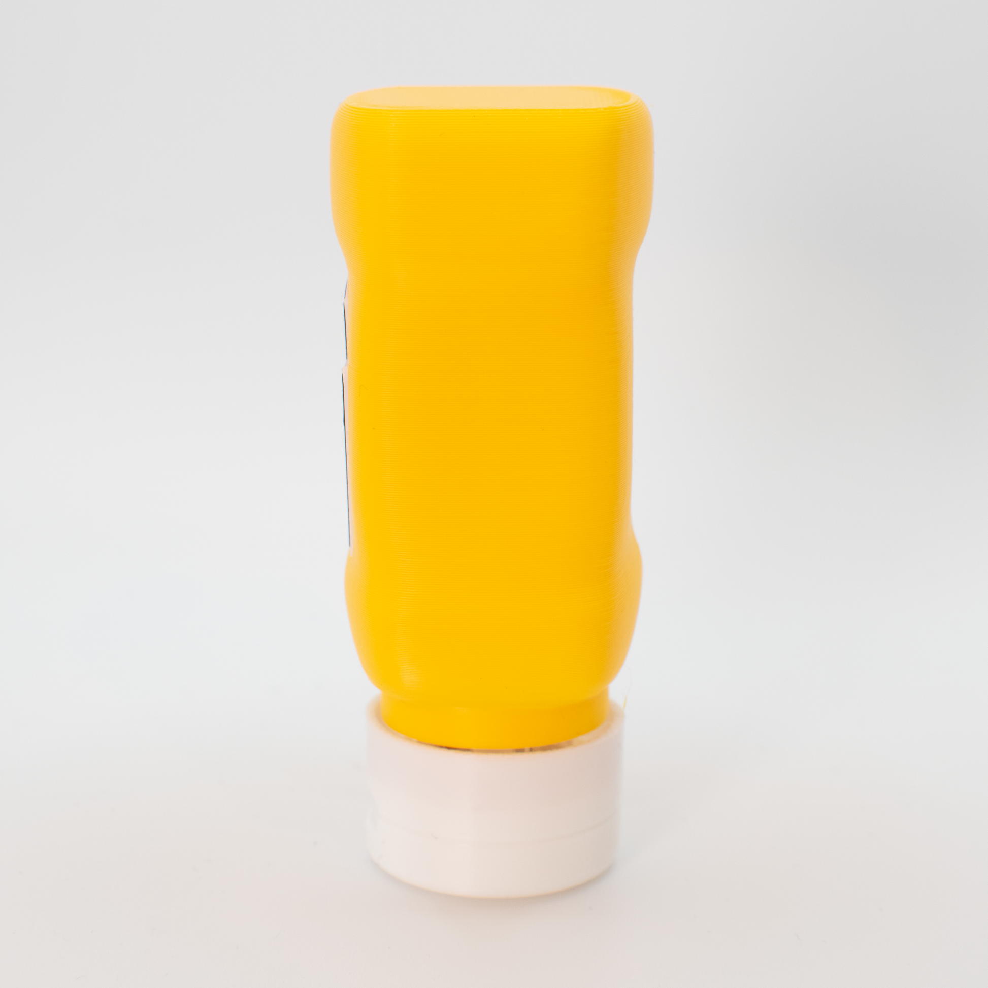 Side view of original mustard fidget clicker