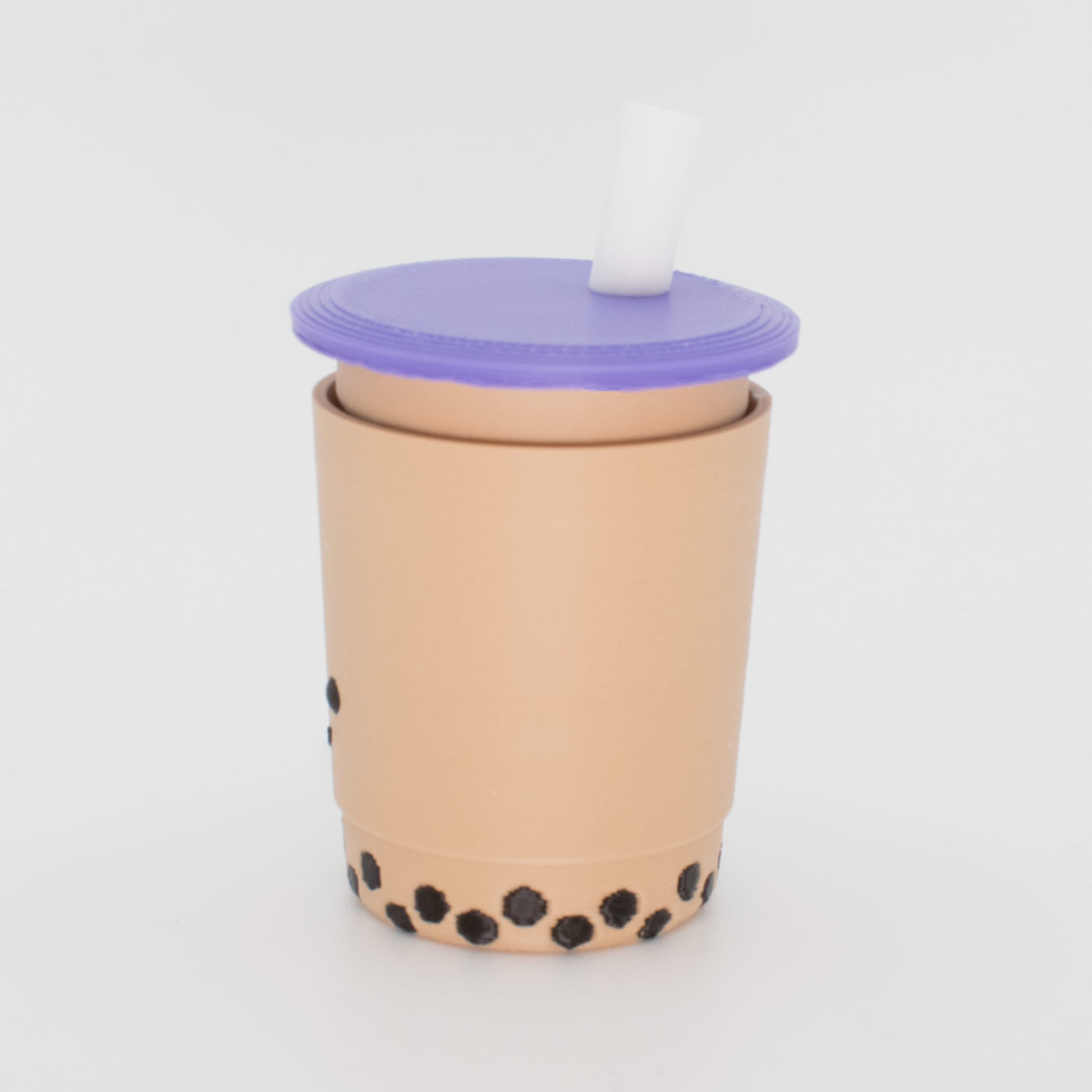 Side view of an original bubble tea fidget clicker keychain with purple lid