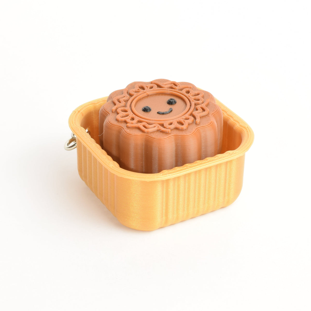 Single mooncake fidget clicker with a cute smiley face and festive mooncake details