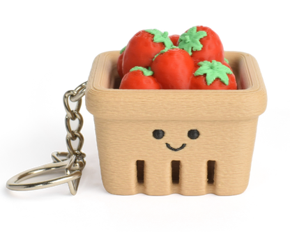 Cute strawberry basket fidget clicker keychain with tiny strawberries and a smiling face