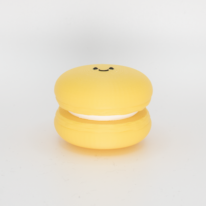 Side view of an original yellow macaron fidget clicker keychain