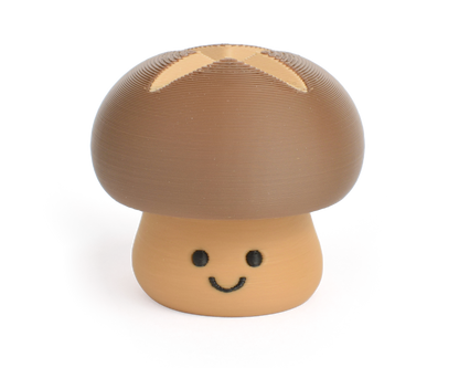 Cute brown shiitake mushroom fidget clicker with a chubby cap and white dots and smiling face