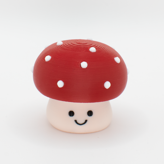 Cute toxic mushroom fidget clicker with a chubby cap and white dots and smiling face