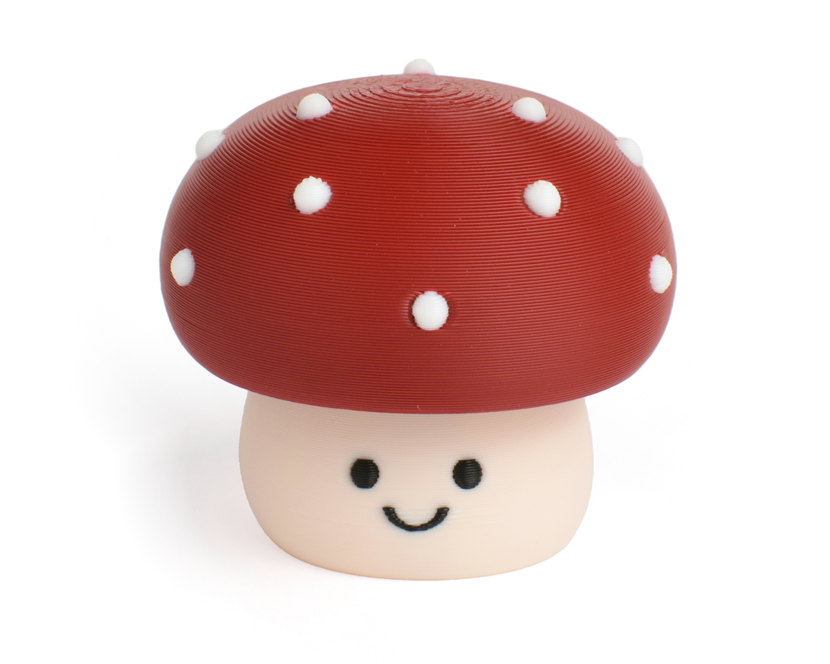 Cute toxic mushroom fidget clicker with a chubby cap and white dots and smiling face
