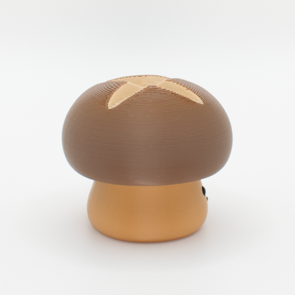 Side view of a chubby mushroom mechanical switch fidget toy