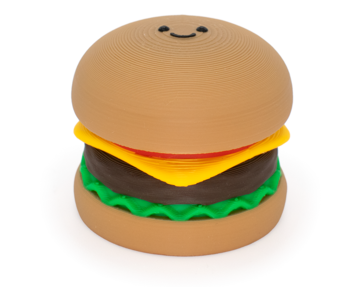 fidget clicker designed as a burger with tomato, cheese, beef patty and lettus with a clickable top bread