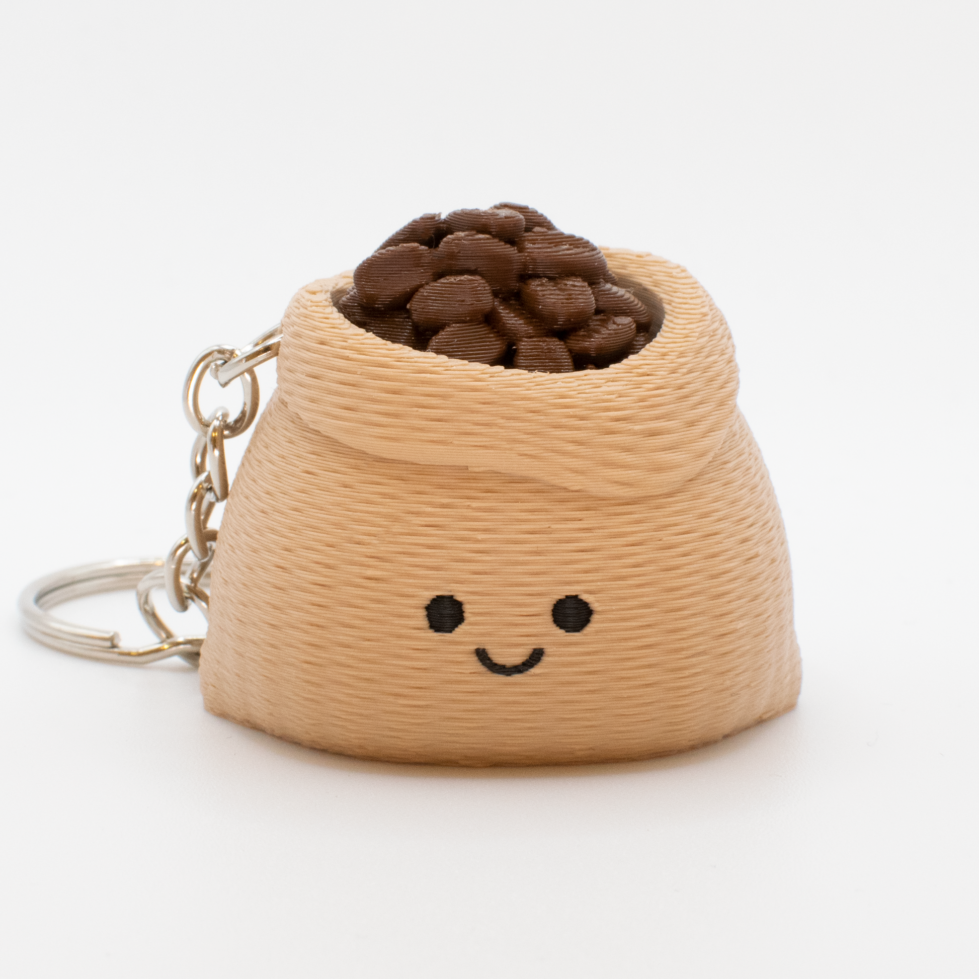 fidget clicker Keychain shaped like a sack filled with coffee beans and with a smiley face