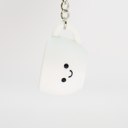 cute coffee clicker being hung on a keychain