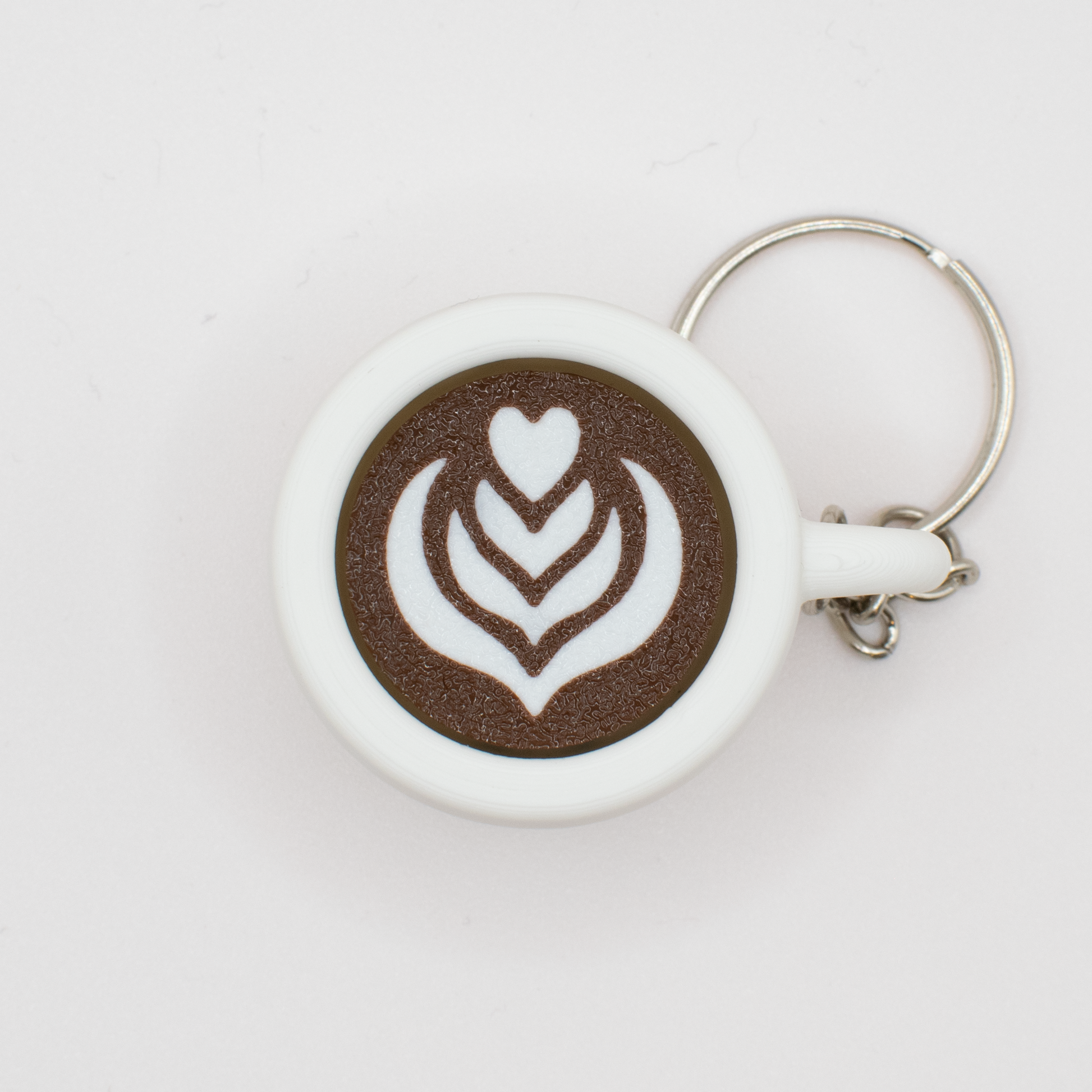 Top view of the coffee clicker with a high-quality 3d printed latte art design 