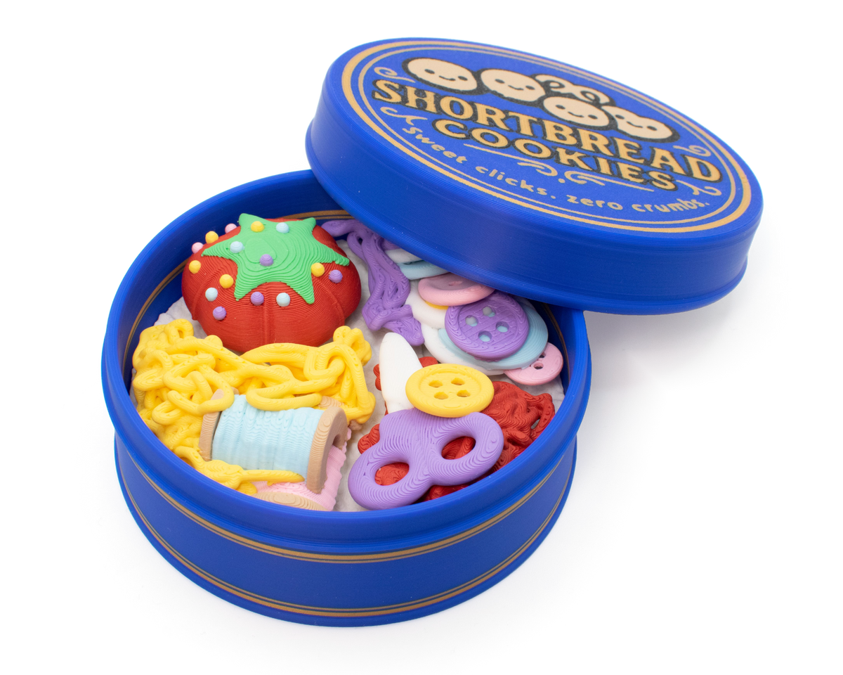 Cute sewing kit cookie tin fidget clicker with tiny sewing supplies and a nostalgic blue tin design