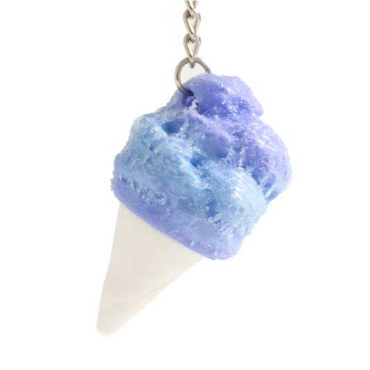 A cotton candy shaped fidget clicker, featuring a textured blue and purple swirled top and a white cone base, suspended from a silver metal chain against a plain white background.