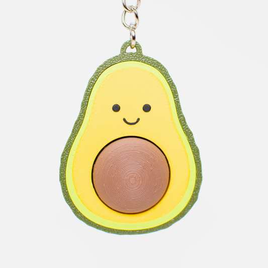 Avocado fidget toy keychain with a smiling face 