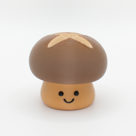 Cute mushroom fidget clicker with a chubby cap and smiling face