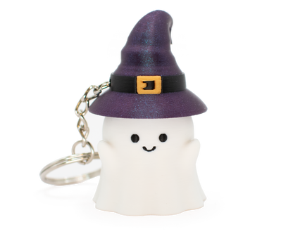 Ghost fidget clicker keychain with a purple witch hat on a white background