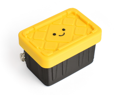 a cute yellow and black container fidget clicker with a smiley face