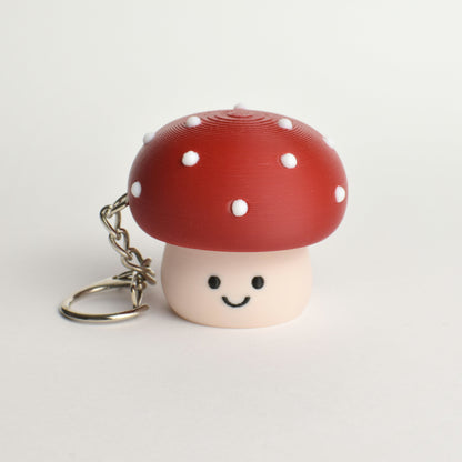 Cute toxic mushroom clicker keychain with a smiling face 