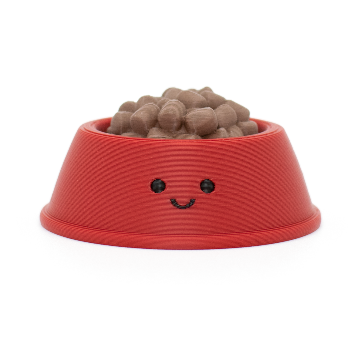 fidget clicker styled as a red pet bowl with a smiley face filled with dog food on a white background