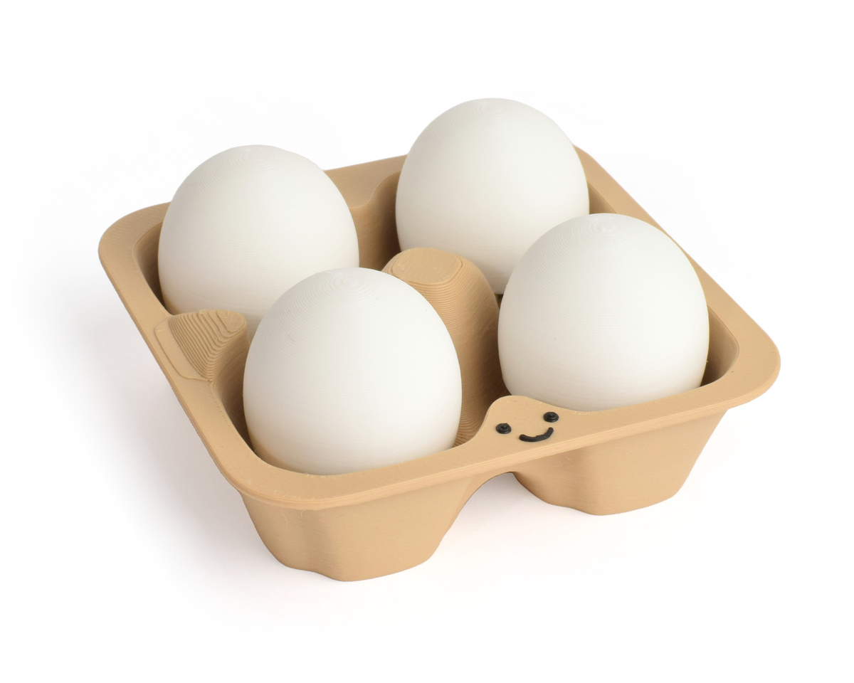 A four-piece cardboard egg carton clicker holding four white eggs, photographed on a clean white background.
