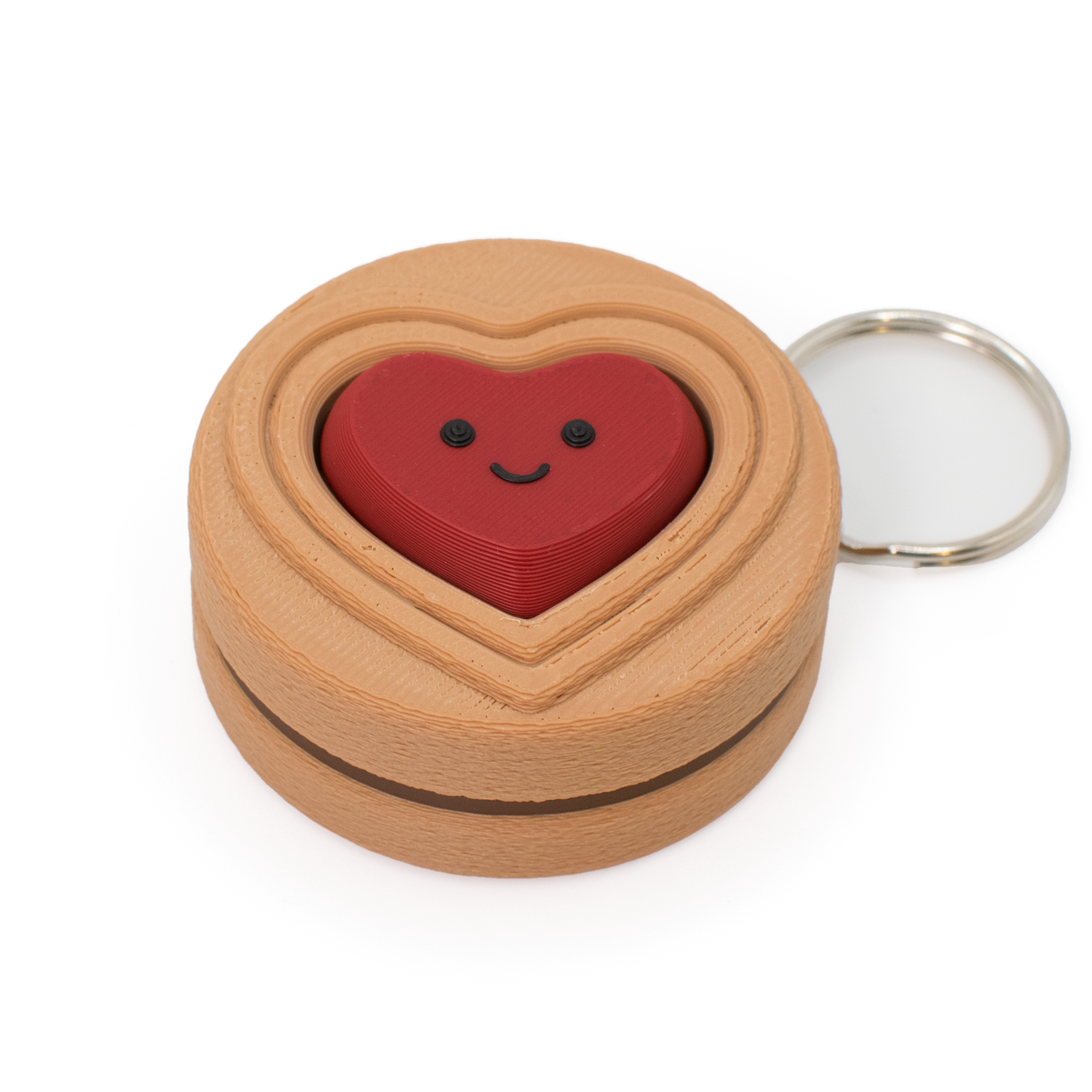 cookie with chocolate color filling clicker keychain with a red heart inside on a white background