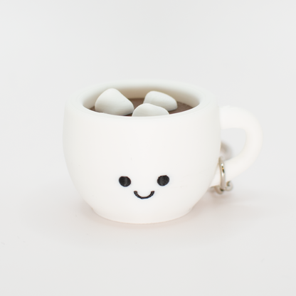 fidget clicker styled as a hot chocolate with marshmallows in a white mug with a smiley face on a white background