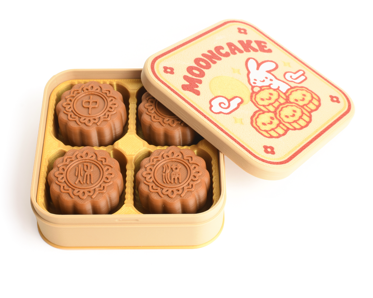 Open mooncake fidget gift box showing 4 clickable mooncakes and festive box lid design