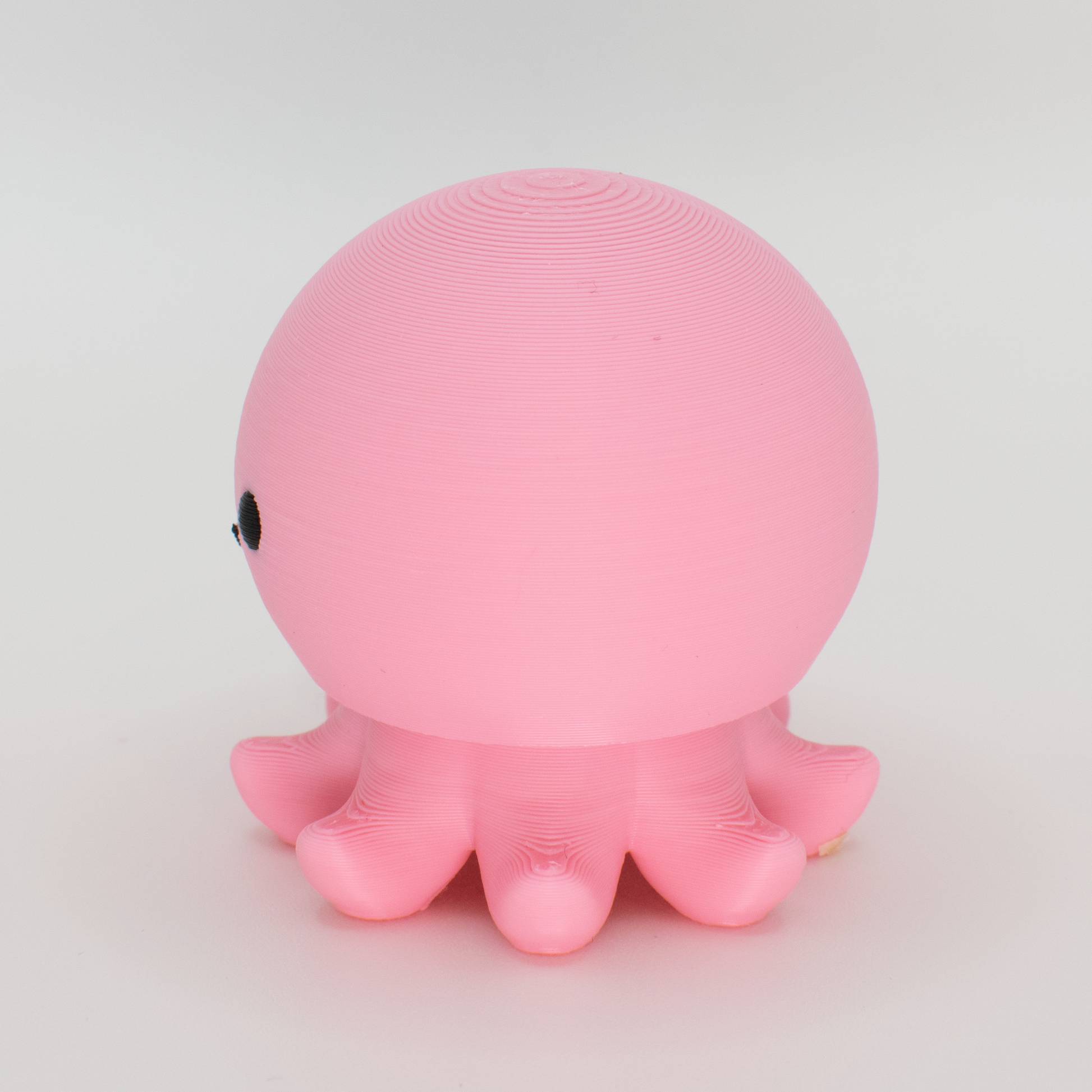 side view of a pink octopus mechanical switch fidget toy 