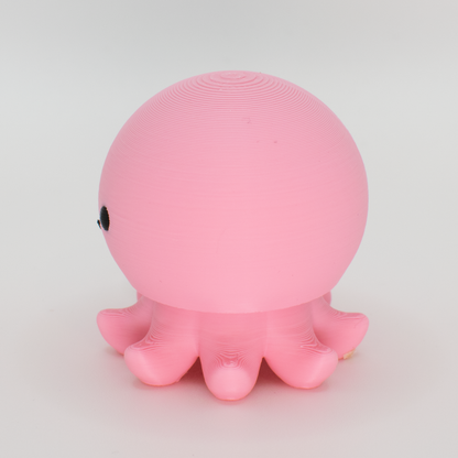 side view of a pink octopus mechanical switch fidget toy 