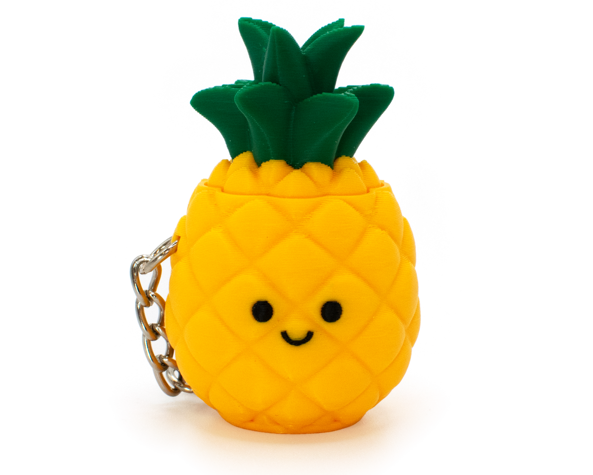 cute fidget clicker styled as a pineapple with a smiley face