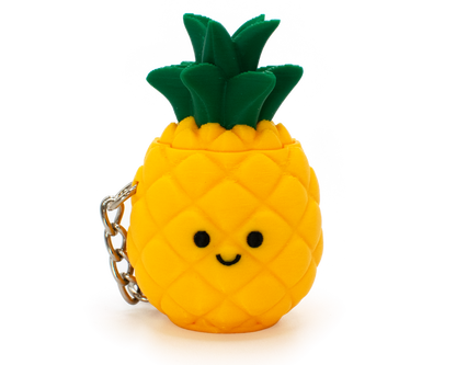 cute fidget clicker styled as a pineapple with a smiley face