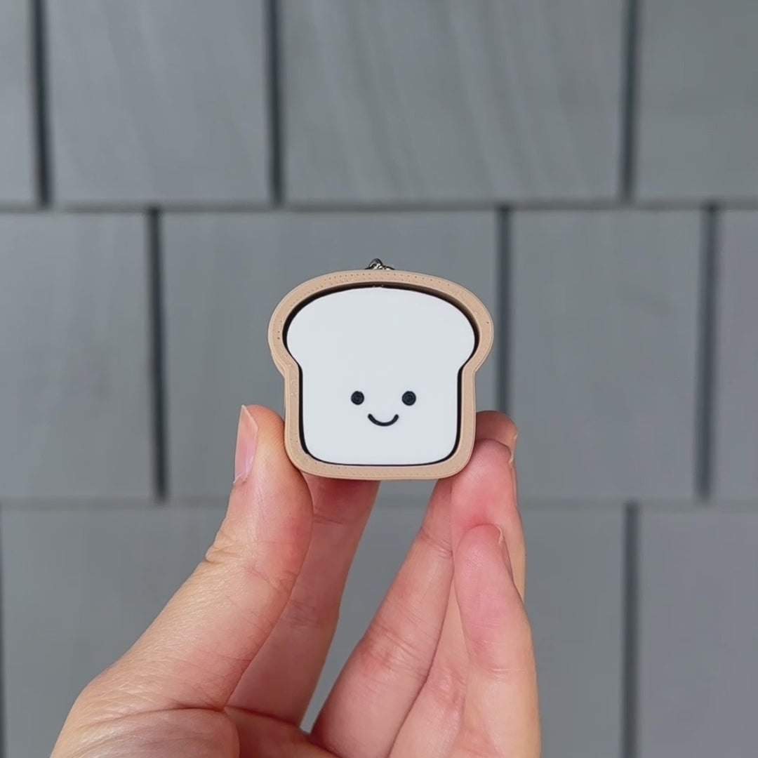 showing and clicking a loaf of white bread fidget toy with a satisfying sound