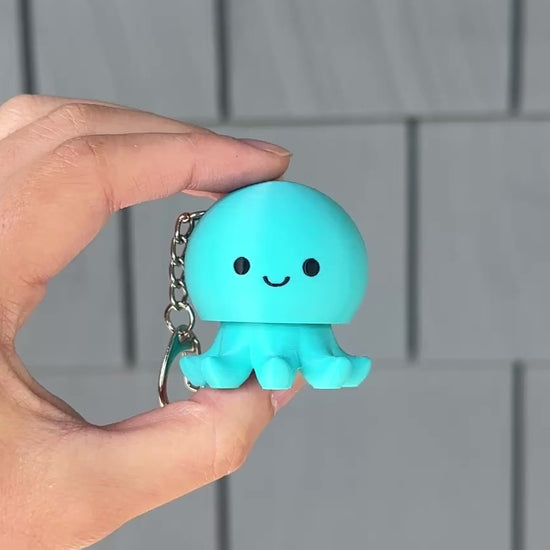 clicking a cute turquoise octopus fidget clicker for stress relief