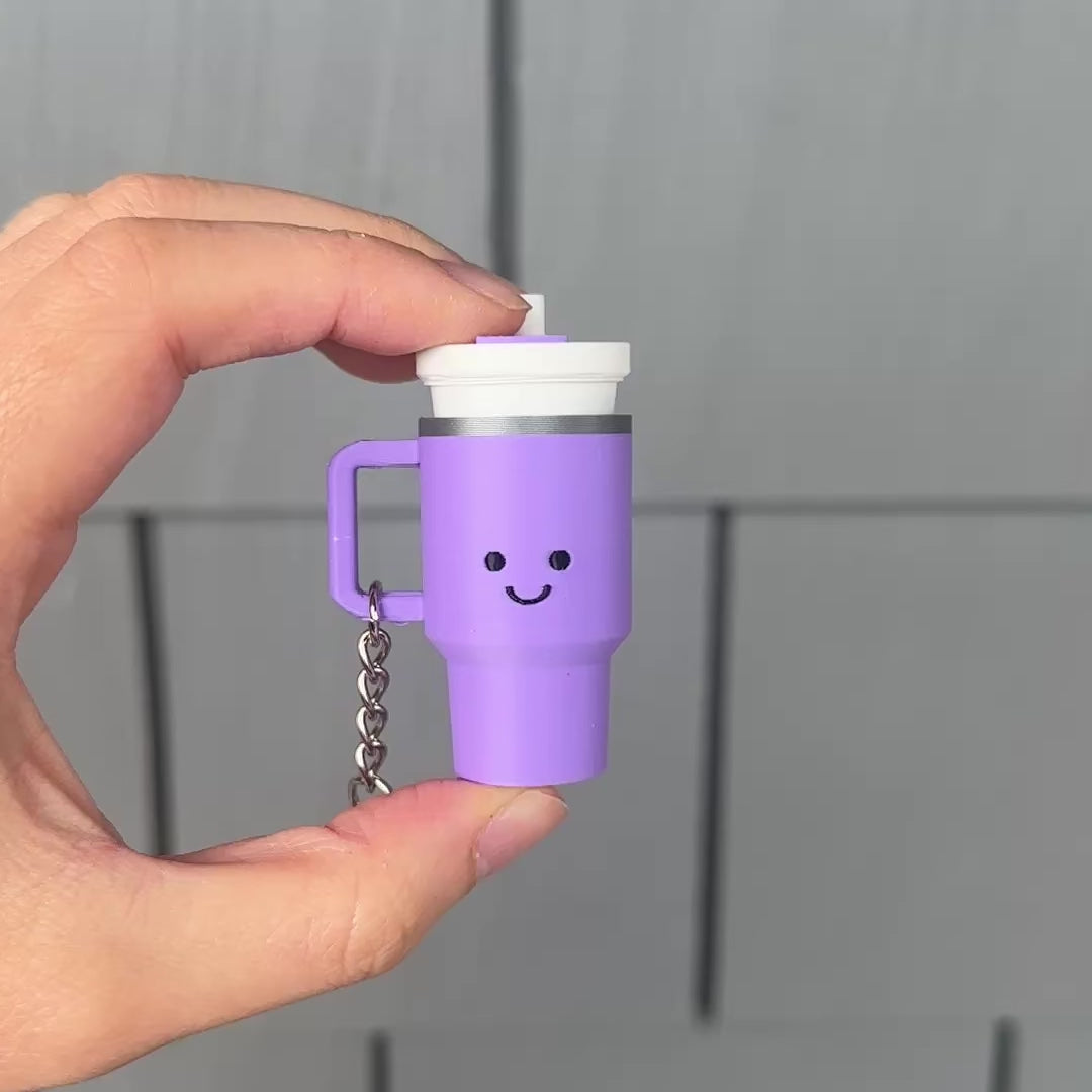clicking a purple mini tumbler fidget clicker