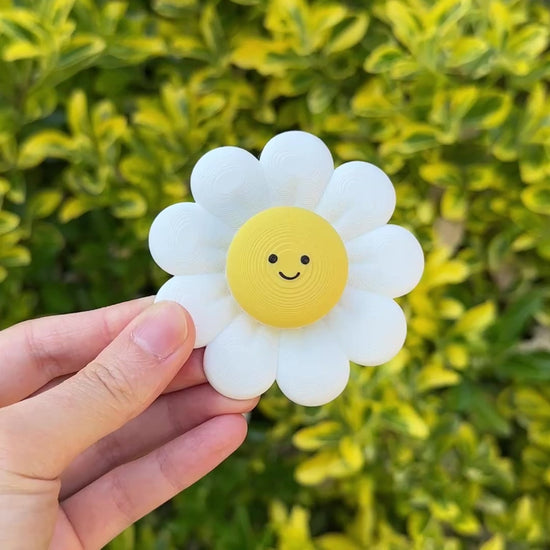 Spinning and clicking the cute daisy flower fidget for calming sensory play