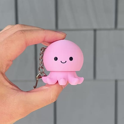 hand clicking a cute octopus fidget clicker keychain for stress relief