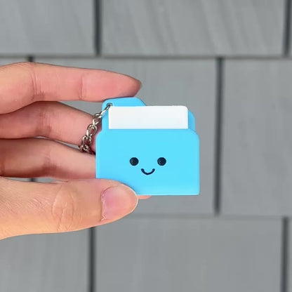 Pressing the cute blue mac folder fidget clicker for a crisp and calming sensory click