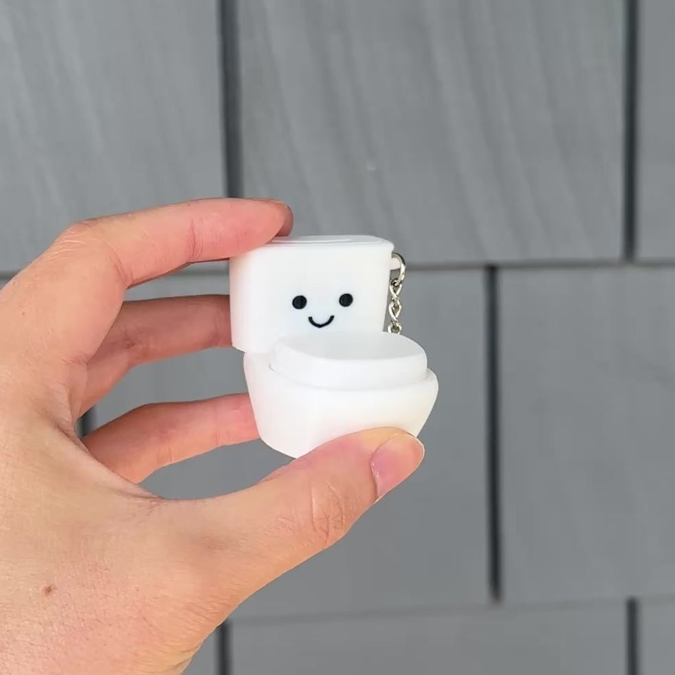 Pressing the funny toilet fidget clicker lid for satisfying tactile sensory clicks