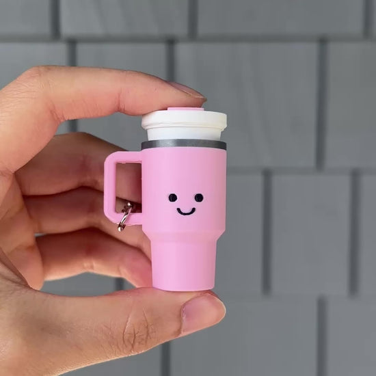 clicking a mini tumbler fidget toy