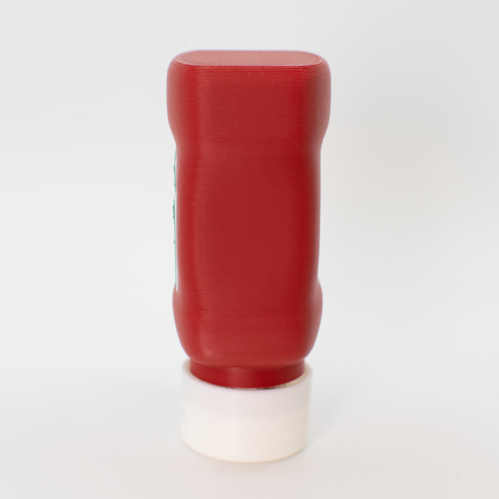 Side view of original ketchup fidget clicker keychains