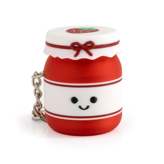 Cute strawberry jam fidget clicker keychain with a smiling face and tiny jar design