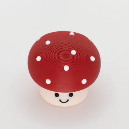Top view of a mushroom clicker showing the round cap and white dots